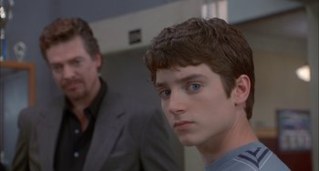 Movie still from “The Faculty” (1998), directed by Robert Rodriguez – A young man and a older man in a room; Close Up shot, Over the shoulder angle
