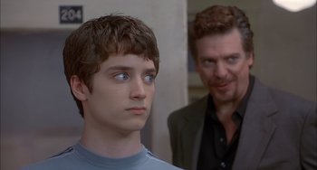 Movie still from “The Faculty” (1998), directed by Robert Rodriguez – A young man and a man with blue eyes; Close Up shot, Over the shoulder angle