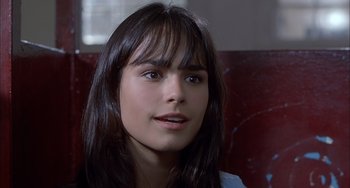 Movie still from “The Faculty” (1998), directed by Robert Rodriguez – A person with long black hair; Close Up shot, High angle