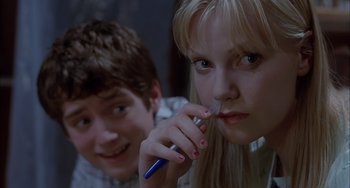 Movie still from “The Faculty” (1998), directed by Robert Rodriguez – A young boy and a young girl brushing their teeth; Close Up shot, Low angle