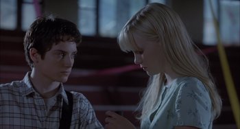 Movie still from “The Faculty” (1998), directed by Robert Rodriguez – A man and a woman sitting next to each other; Close Up shot, Over the shoulder angle