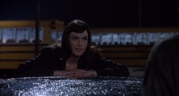 Movie still from “The Faculty” (1998), directed by Robert Rodriguez – A woman sitting at a table in front of a mirror; Close Up shot, Low angle
