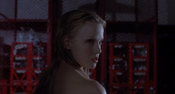 Movie still from “The Faculty” (1998), directed by Robert Rodriguez – A beautiful young woman with long blonde hair; Close Up shot, Low angle