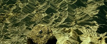 Movie still from “Point Break” (2015), directed by Ericson Core – Extreme Wide shot, Overhead angle
