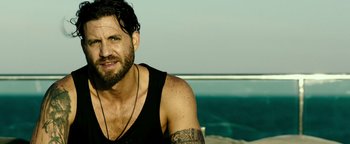 Movie still from “Point Break” (2015), directed by Ericson Core – Close Up shot, Over the shoulder angle