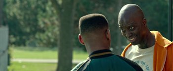 Movie still from “The First Purge” (2018), directed by Gerard McMurray – A young man's head and neck with trees in the background; Close Up shot, Over the shoulder angle