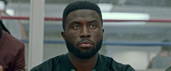 Movie still from “The First Purge” (2018), directed by Gerard McMurray – A person with a beard; Close Up shot, Low angle