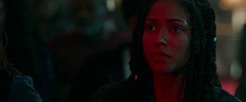 Movie still from “The First Purge” (2018), directed by Gerard McMurray – A person looking at the camera; Close Up shot, Over the shoulder angle