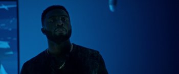 Movie still from “The First Purge” (2018), directed by Gerard McMurray – A person wearing a black jacket; Close Up shot, Low angle