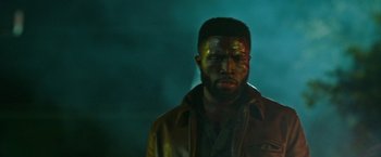 Movie still from “The First Purge” (2018), directed by Gerard McMurray – A black man with a face paint on his face; Close Up shot, Low angle