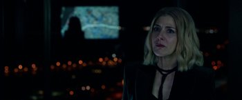 Movie still from “The First Purge” (2018), directed by Gerard McMurray – A woman in a black jacket looking at the camera; Close Up shot, Over the shoulder angle
