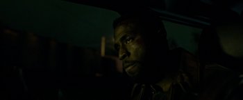 Movie still from “The First Purge” (2018), directed by Gerard McMurray – A person in a car at night; Close Up shot, Over the shoulder angle