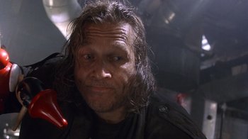 Movie still from “The Fisher King” (1991), directed by Terry Gilliam – A person wearing a black jacket; Close Up shot, Low angle
