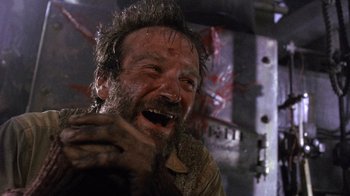 Movie still from “The Fisher King” (1991), directed by Terry Gilliam – An old man with a messy hair style laughing with his hands on his chest; Close Up shot, Low angle