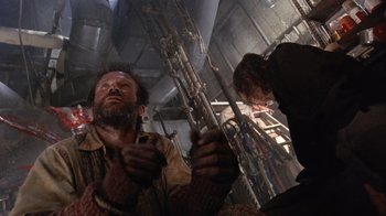 Movie still from “The Fisher King” (1991), directed by Terry Gilliam – A man and a woman in a room with wires; Medium shot, Low angle