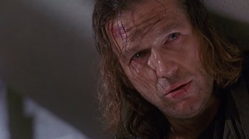 Movie still from “The Fisher King” (1991), directed by Terry Gilliam – A person with long hair; Close Up shot, Low angle
