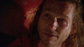 Movie still from “The Fisher King” (1991), directed by Terry Gilliam – A man with long hair; Close Up shot, Over the shoulder angle