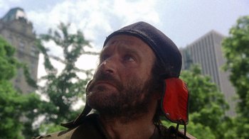 Movie still from “The Fisher King” (1991), directed by Terry Gilliam – A person wearing a hat; Close Up shot, Low angle