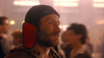 Movie still from “The Fisher King” (1991), directed by Terry Gilliam – A person wearing a hat; Close Up shot, Low angle