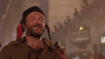 Movie still from “The Fisher King” (1991), directed by Terry Gilliam – A person wearing a hat; Close Up shot, Low angle