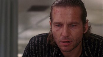 Movie still from “The Fisher King” (1991), directed by Terry Gilliam – A person with long hair; Close Up shot, Over the shoulder angle