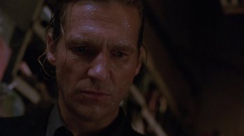 Movie still from “The Fisher King” (1991), directed by Terry Gilliam – A man's face in a dark room; Close Up shot, Low angle