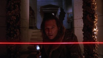 Movie still from “The Fisher King” (1991), directed by Terry Gilliam – A man is holding a flashlight in his hand; Close Up shot, Low angle