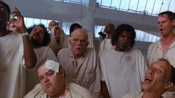 Movie still from “The Fisher King” (1991), directed by Terry Gilliam – A group of men in white shirts and bandages; Medium shot, Low angle
