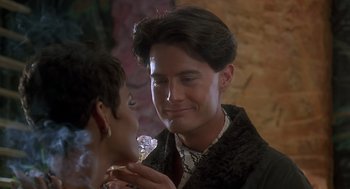 Movie still from “The Flintstones” (1994), directed by Brian Levant – A man and a woman looking at each other; Close Up shot, Over the shoulder angle