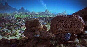 Movie still from “The Flintstones” (1994), directed by Brian Levant – A sign that says " welcome to bedlam first world " on the rocks; Extreme Wide shot, High angle
