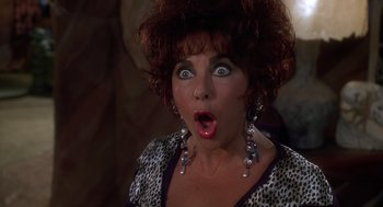 Movie still from “The Flintstones” (1994), directed by Brian Levant – A person with a surprised look on their face; Close Up shot, High angle