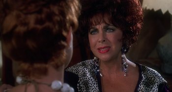 Movie still from “The Flintstones” (1994), directed by Brian Levant – An older woman looking at her reflection in a mirror; Close Up shot, Over the shoulder angle