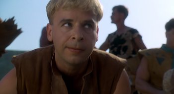 Movie still from “The Flintstones” (1994), directed by Brian Levant – A person looking up at the sky; Close Up shot, Over the shoulder angle