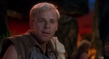 Movie still from “The Flintstones” (1994), directed by Brian Levant – A person wearing a jacket; Close Up shot, Over the shoulder angle