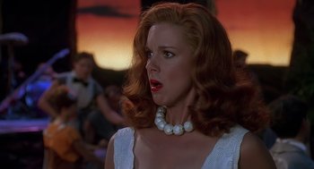Movie still from “The Flintstones” (1994), directed by Brian Levant – A person wearing a dress and a pearl necklace; Close Up shot, Low angle