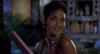 Movie still from “The Flintstones” (1994), directed by Brian Levant – A person wearing a necklace; Close Up shot, Over the shoulder angle