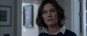 Movie still from “The Foreigner” (2017), directed by Martin Campbell – A person wearing a sweater; Close Up shot, Over the shoulder angle