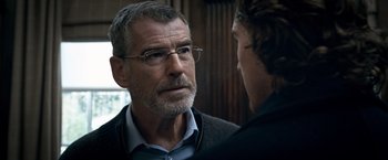 Movie still from “The Foreigner” (2017), directed by Martin Campbell – An older man wearing glasses talking to a younger man; Close Up shot, Over the shoulder angle