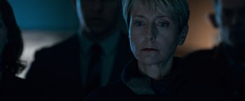 Movie still from “The Foreigner” (2017), directed by Martin Campbell – A man and a woman looking at something in the dark; Close Up shot, Over the shoulder angle