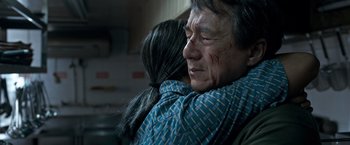 Movie still from “The Foreigner” (2017), directed by Martin Campbell – An older man is hugging a younger woman; Close Up shot, Over the shoulder angle