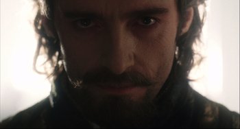 Movie still from “The Fountain” (2006), directed by Darren Aronofsky – Close up of a man with a long beard looking straight ahead; Close Up shot, Low angle