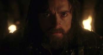 Movie still from “The Fountain” (2006), directed by Darren Aronofsky – A person with long hair and a beard; Close Up shot, Low angle