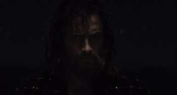 Movie still from “The Fountain” (2006), directed by Darren Aronofsky – A person with long dark hair; Close Up shot, Over the shoulder angle