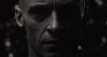 Movie still from “The Fountain” (2006), directed by Darren Aronofsky – A man's face in the dark; Extreme Close Up shot, Low angle