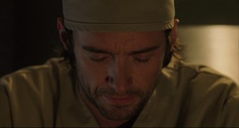 Movie still from “The Fountain” (2006), directed by Darren Aronofsky – A person with his eyes closed; Close Up shot, Over the shoulder angle