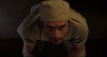 Movie still from “The Fountain” (2006), directed by Darren Aronofsky – A person wearing a hat; Close Up shot, Overhead angle