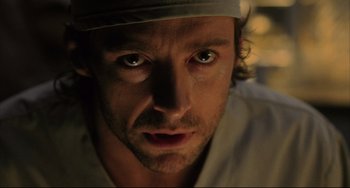 Movie still from “The Fountain” (2006), directed by Darren Aronofsky – A person with a hat on; Close Up shot, Over the shoulder angle