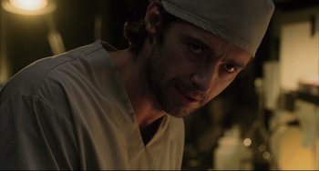 Movie still from “The Fountain” (2006), directed by Darren Aronofsky – A person wearing a hat; Close Up shot, Over the shoulder angle