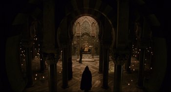 Movie still from “The Fountain” (2006), directed by Darren Aronofsky – A person is standing in the middle of an ornate room; Extreme Wide shot, High angle