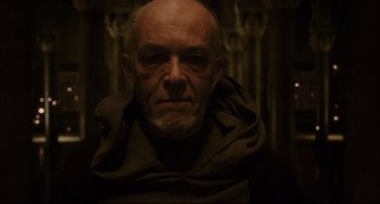 Movie still from “The Fountain” (2006), directed by Darren Aronofsky – An old man with a beard and a monk's robe; Close Up shot, Low angle
